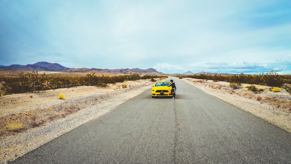 yellow car on road