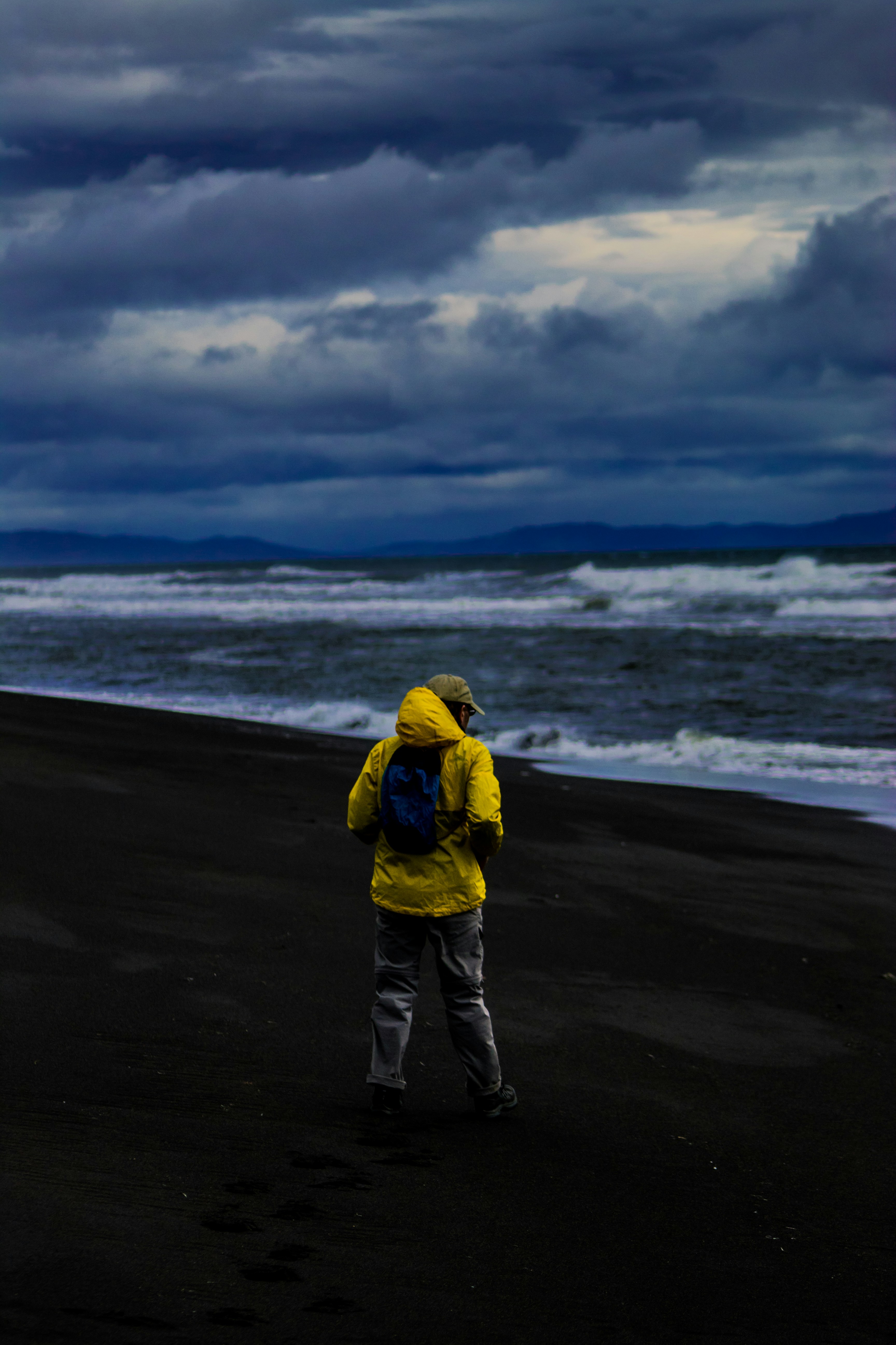 man wears yellow pullover hoodie