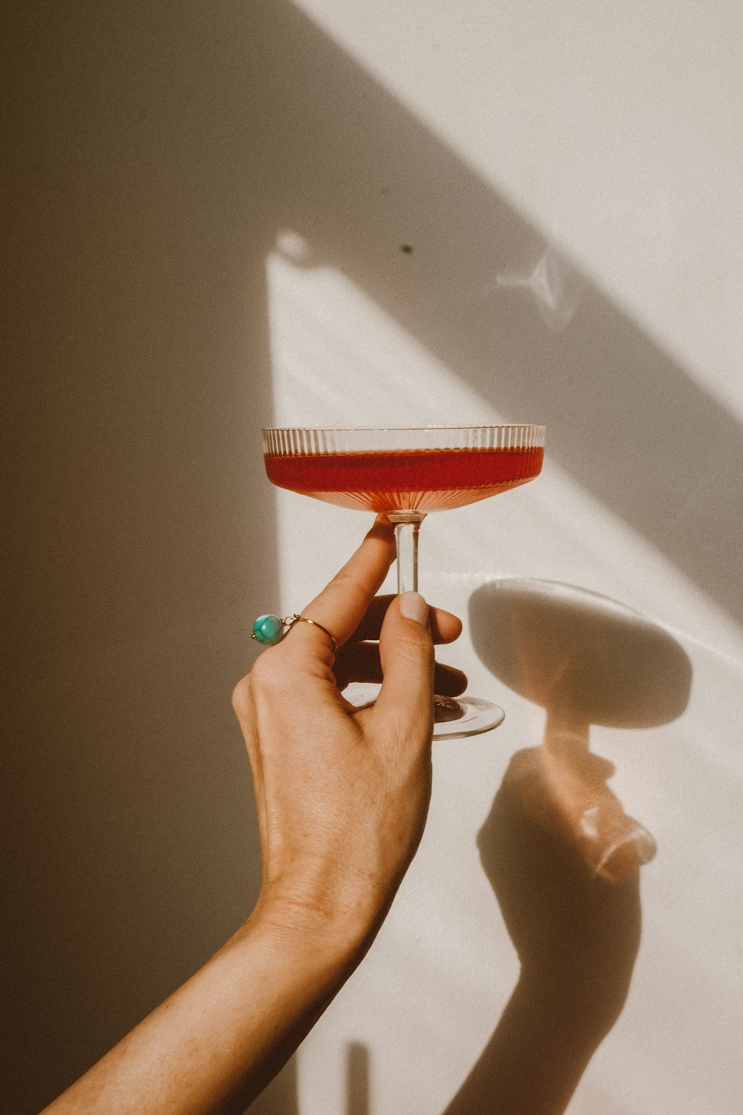 clear wine glass with red liquid