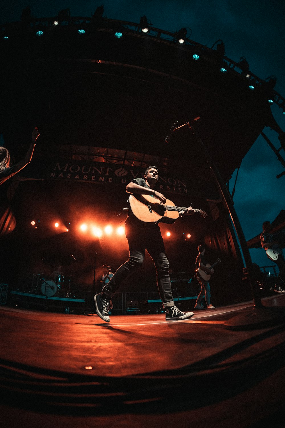 man playing acoustic guitar