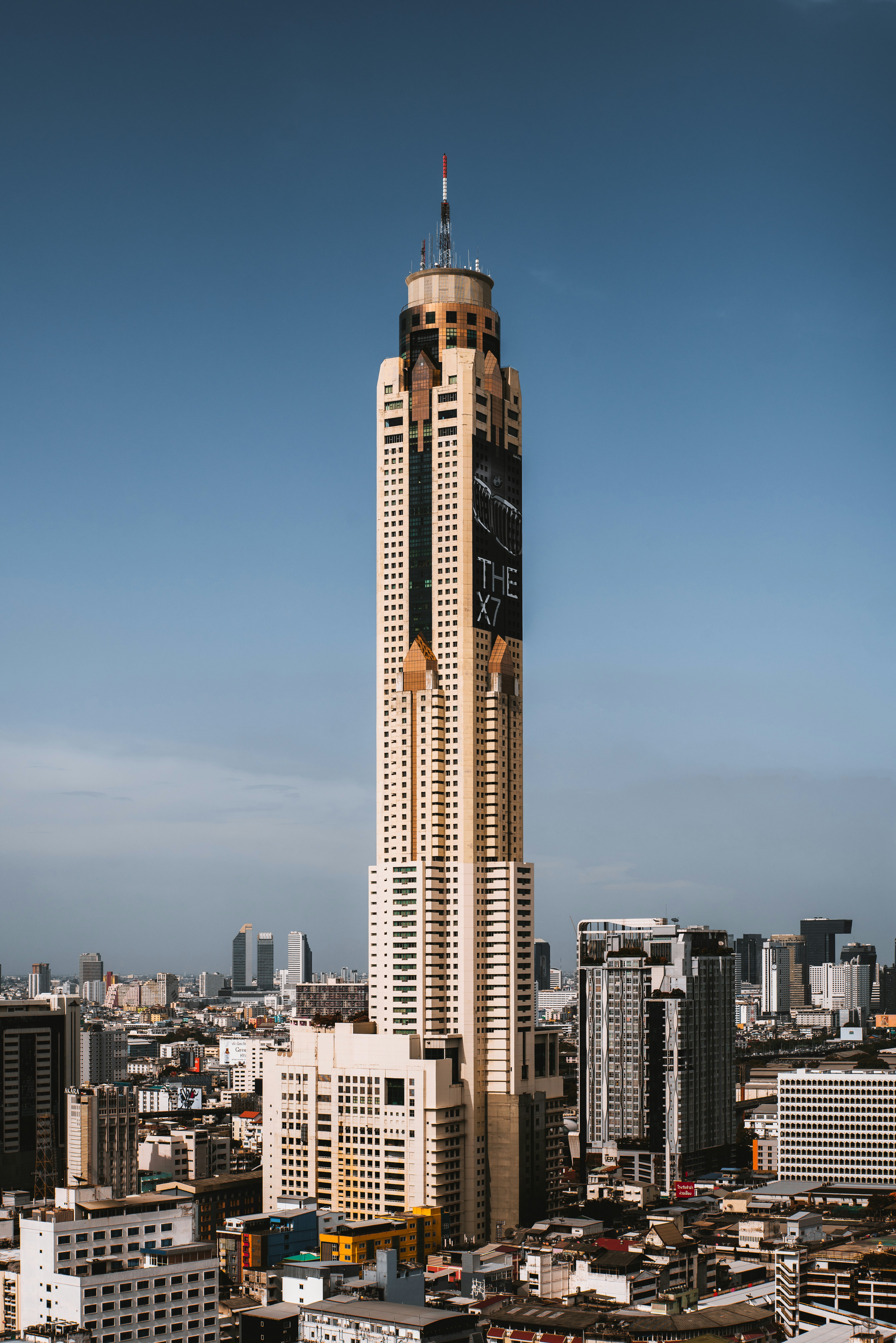 a very tall building towering over a city