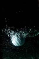 white golf ball on water