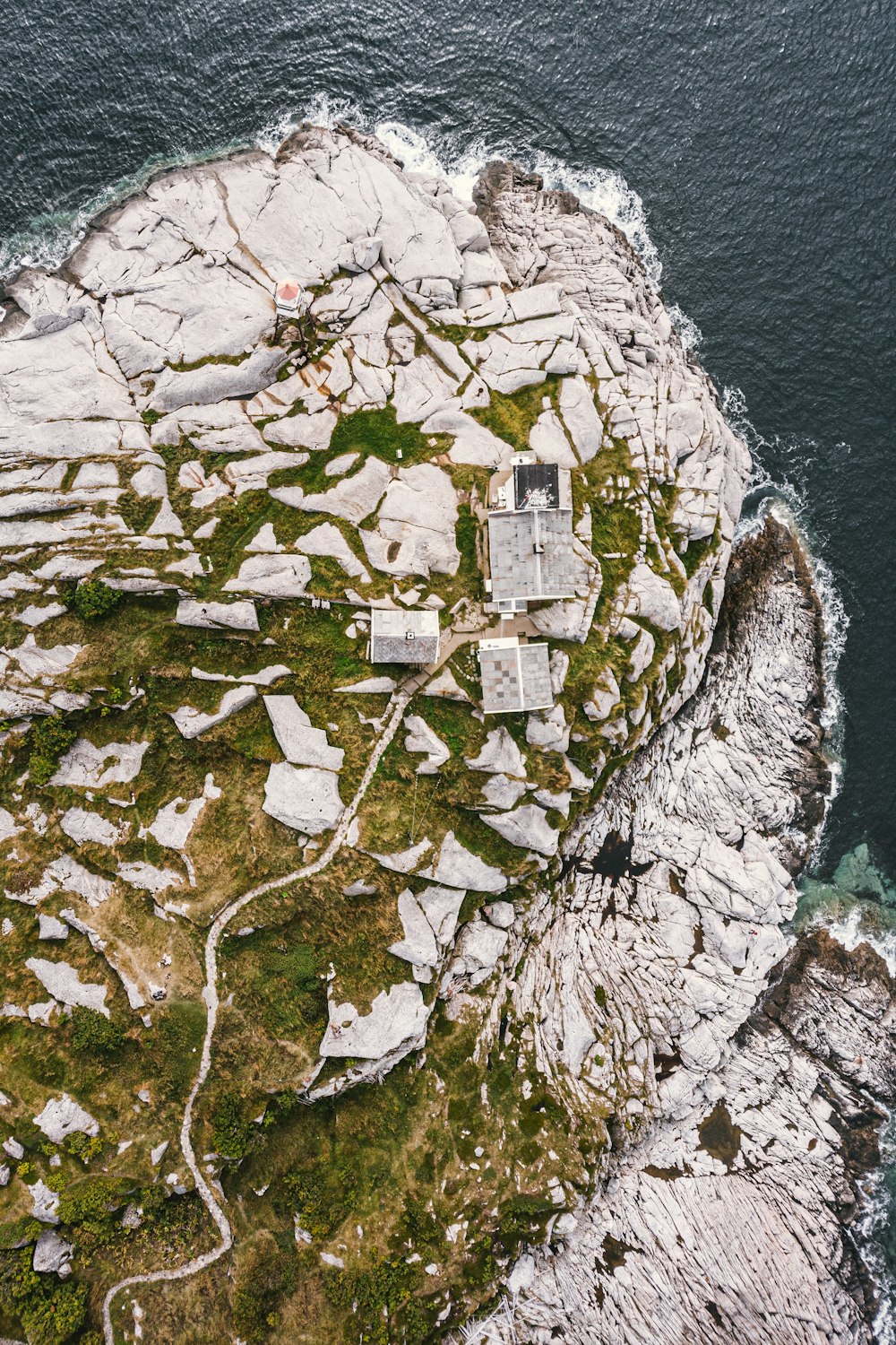 high-angle photography of island surrounded by sea