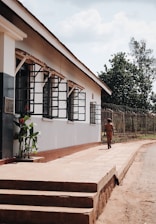 Uniformed security personnel patrolling a commercial property under clear skies.