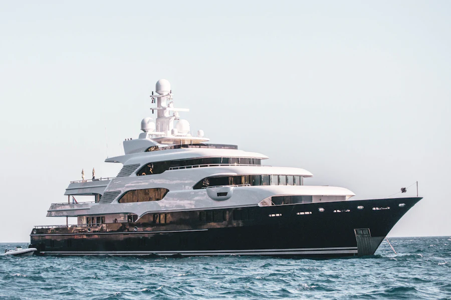 A yacht at anchor in flat water.