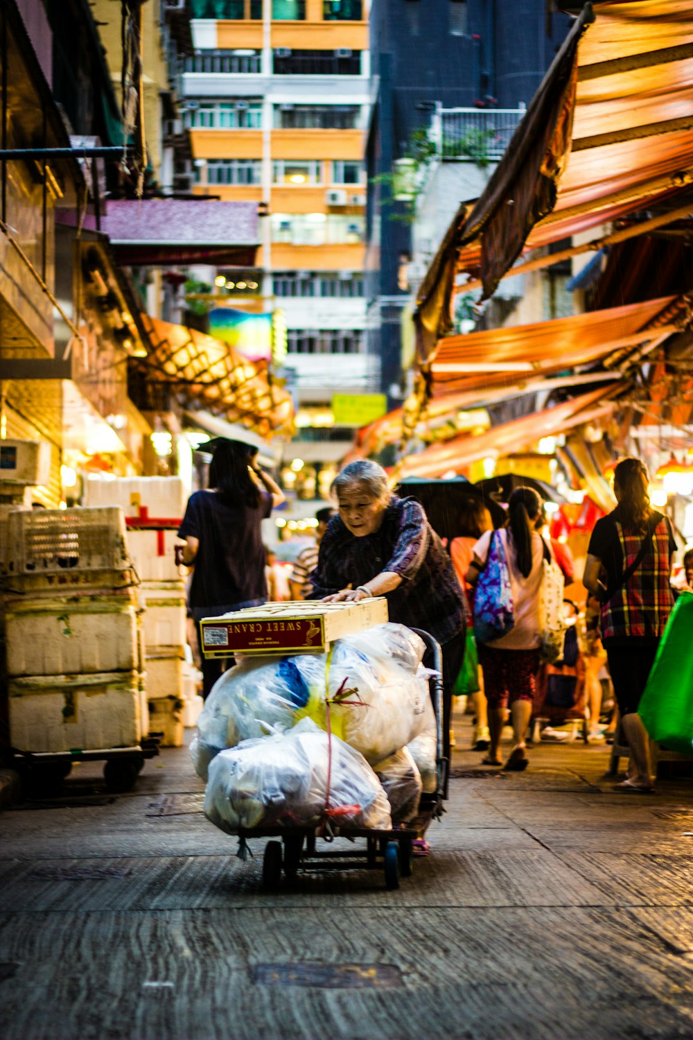 woman pushing hand truck