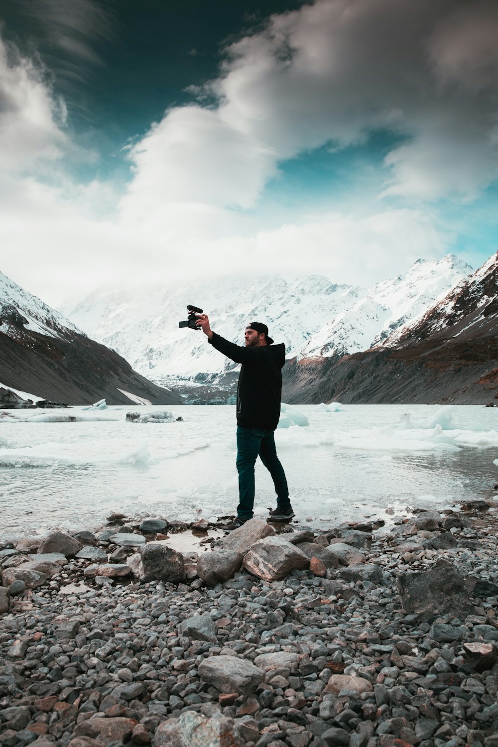 man in black jacket taking selfie