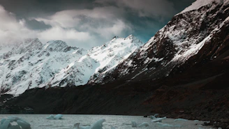 A serene southern Chilean landscape with cold winds sweeping over rugged mountains and calm waters.