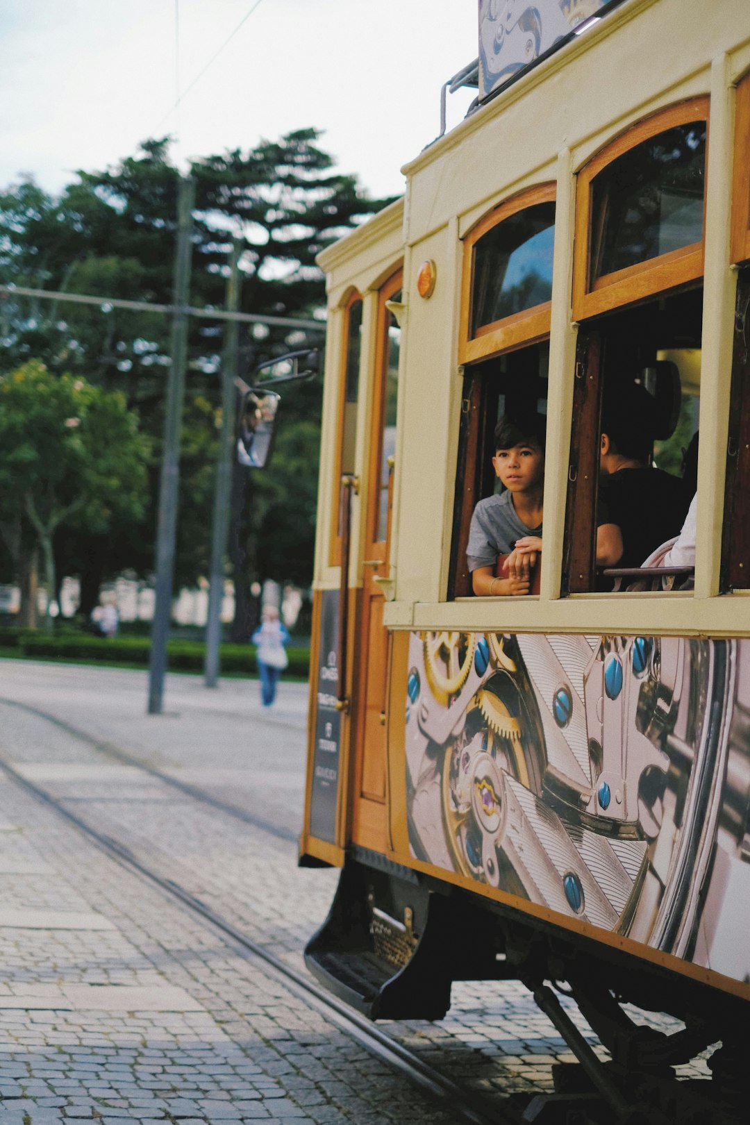 people riding tramp during daytime