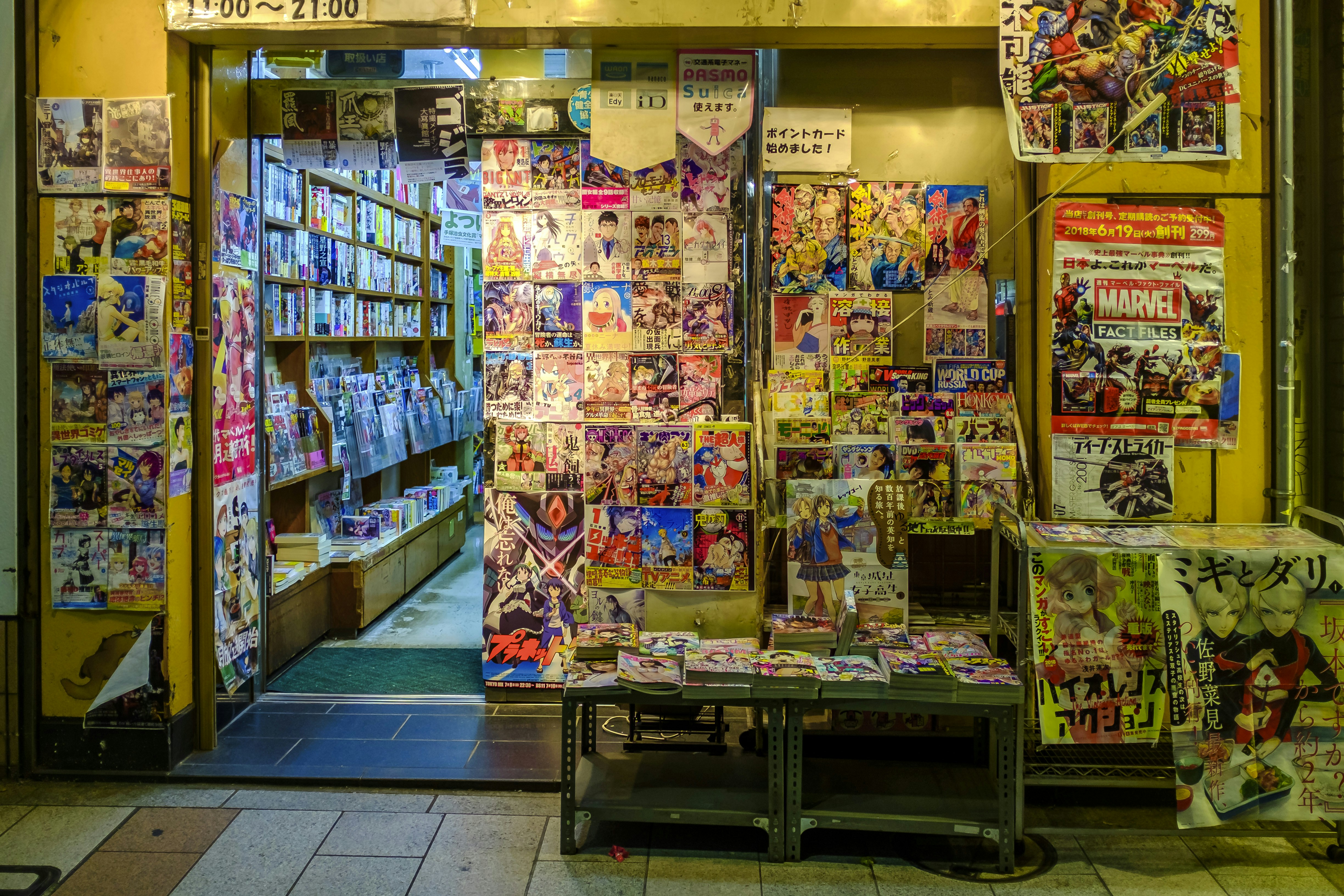 Comic book store in Tokyo Japan.Tokyo is the combination of 26 neighbourhoods, every singel one with it's own identity. Every neighbourhood has a commercial area the has neon, shops, restaurants and people.