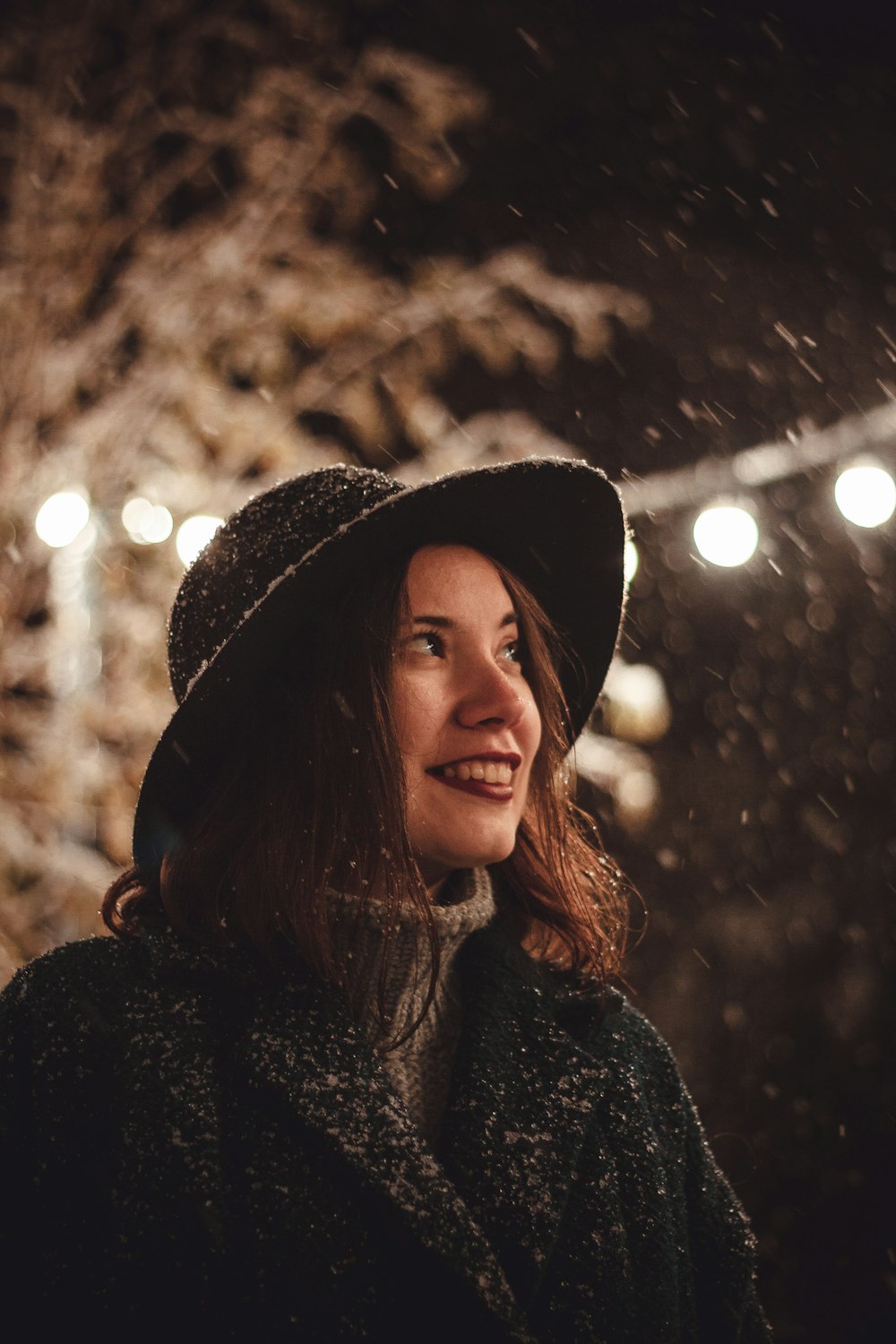 woman in coat near tree