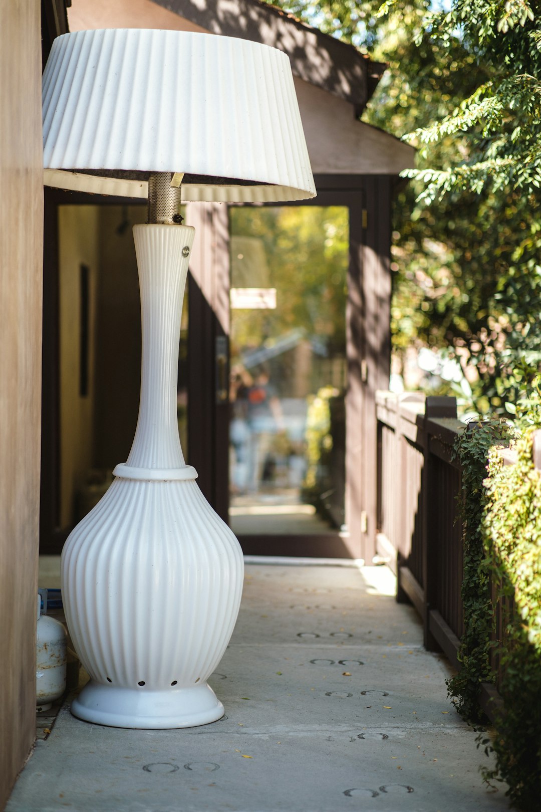 white table lamp on concrete pavement