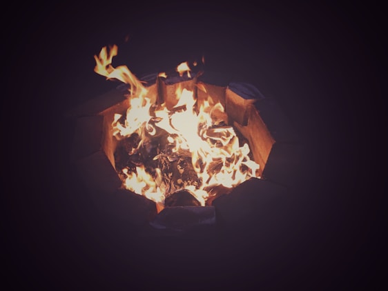 A warm, inviting fire pit surrounded by people sharing traditional Anatolian dishes.