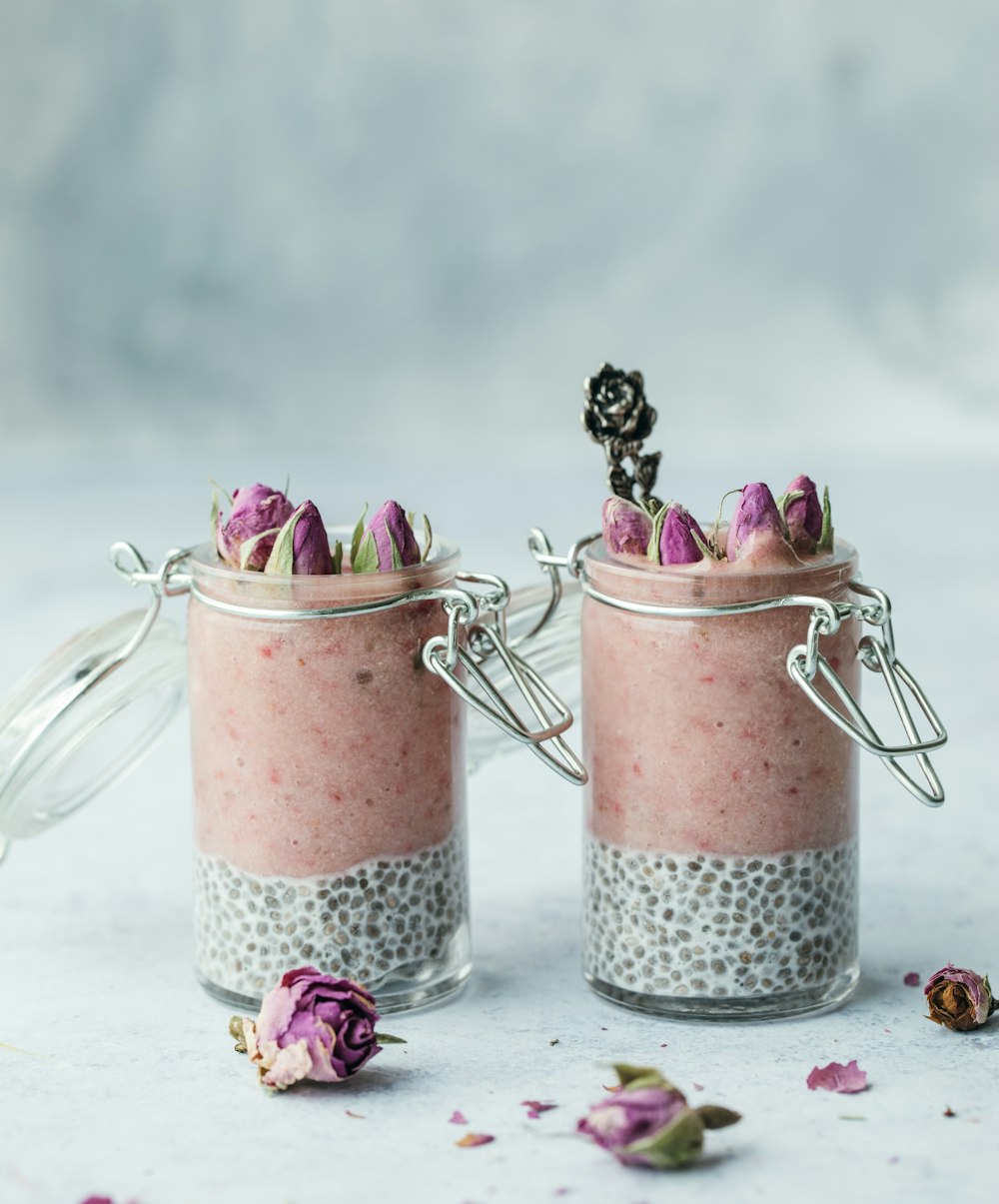 two clear glass canister jars