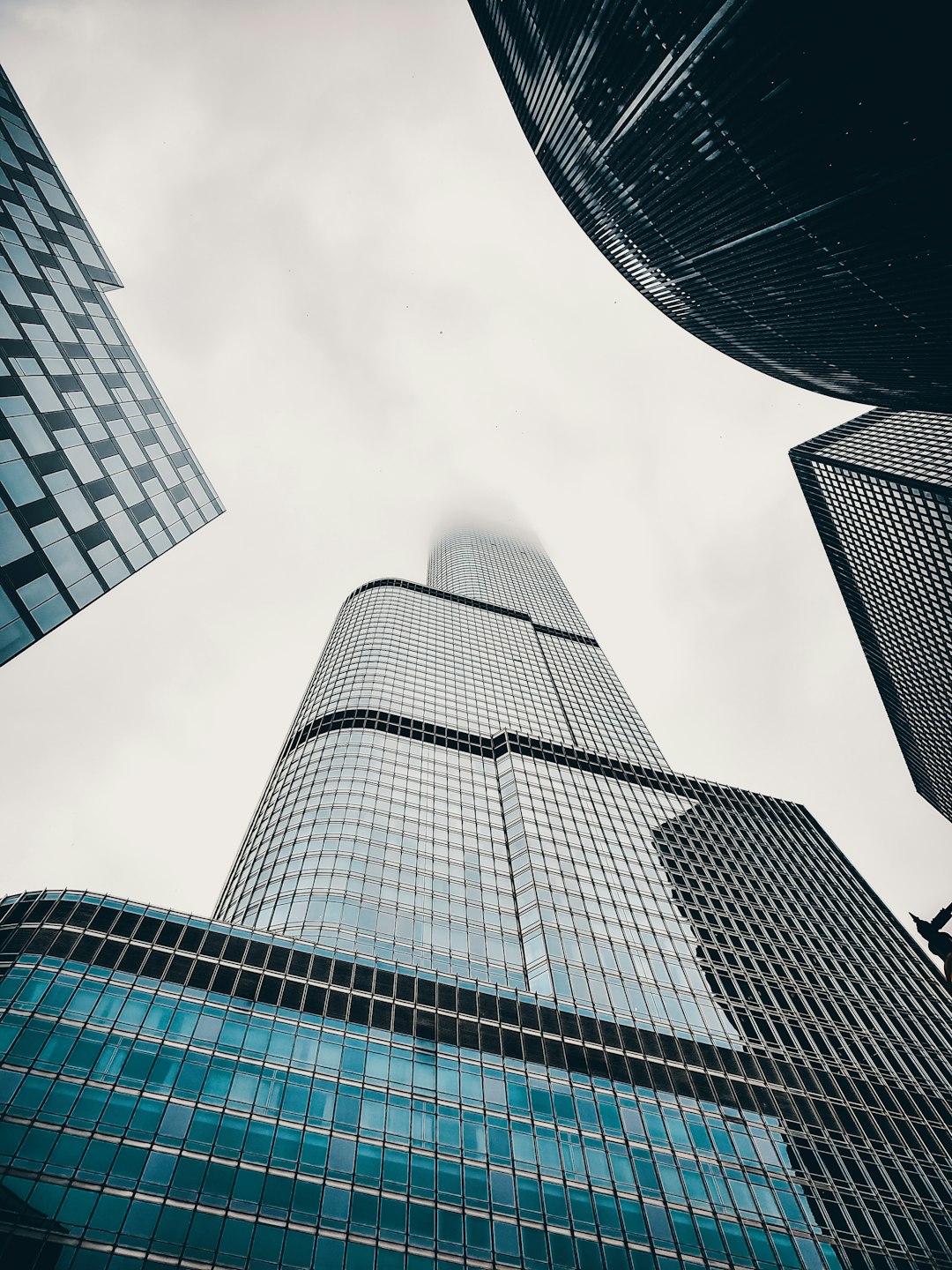 low-angle photography of curtain wall high-rise building during daytime