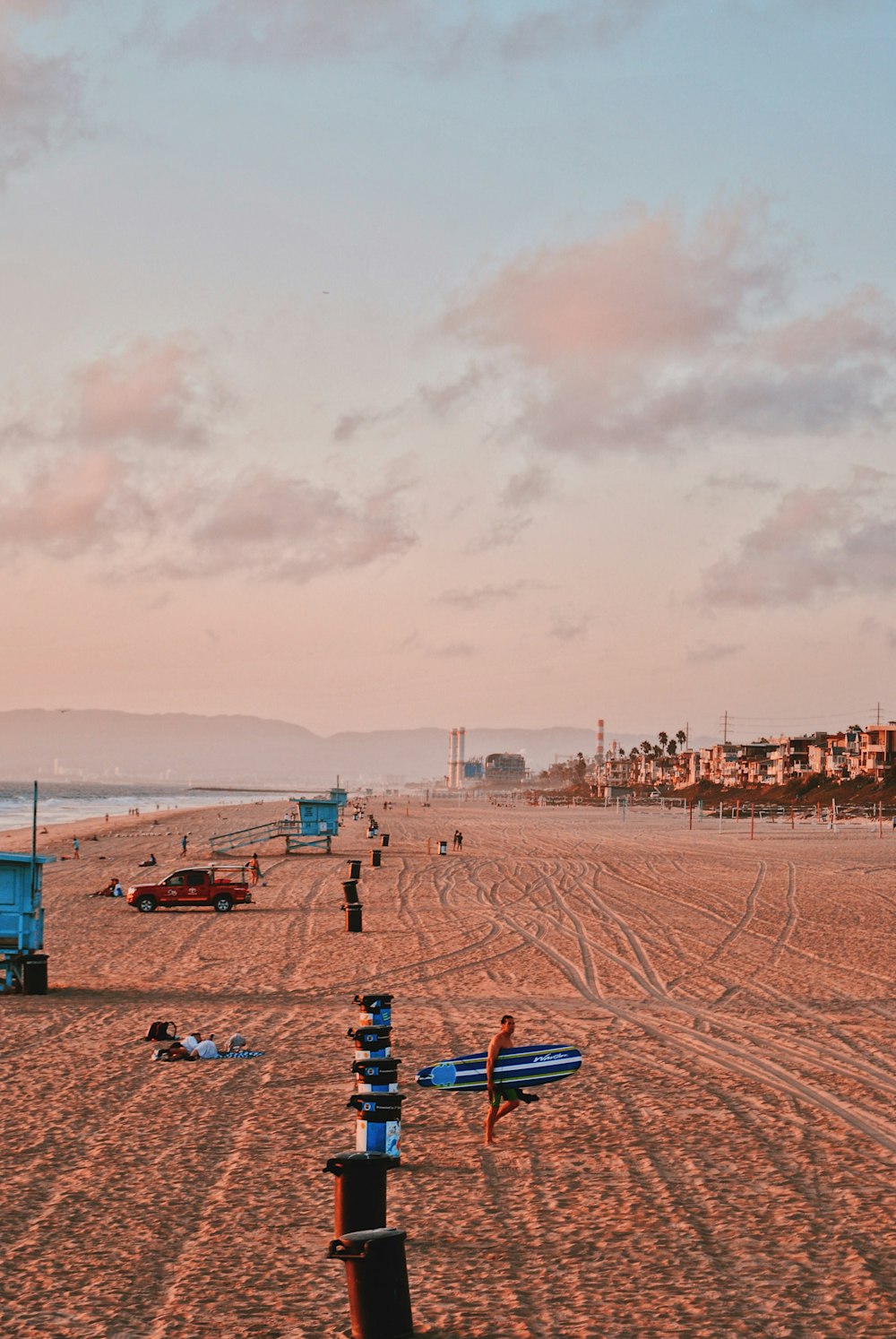 people on seashore under blue sky