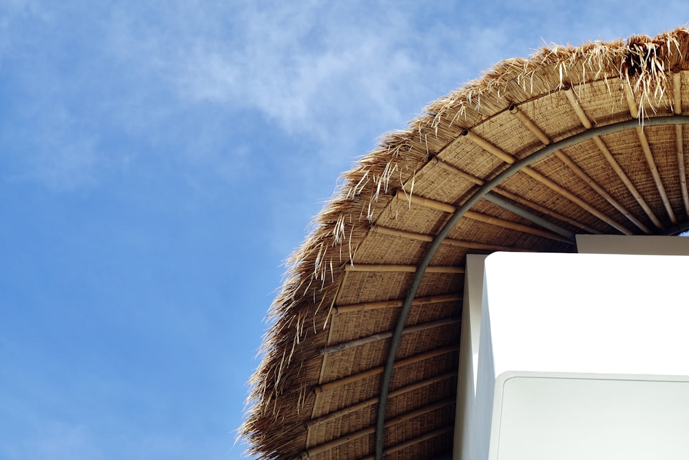 brown hut under clear sky