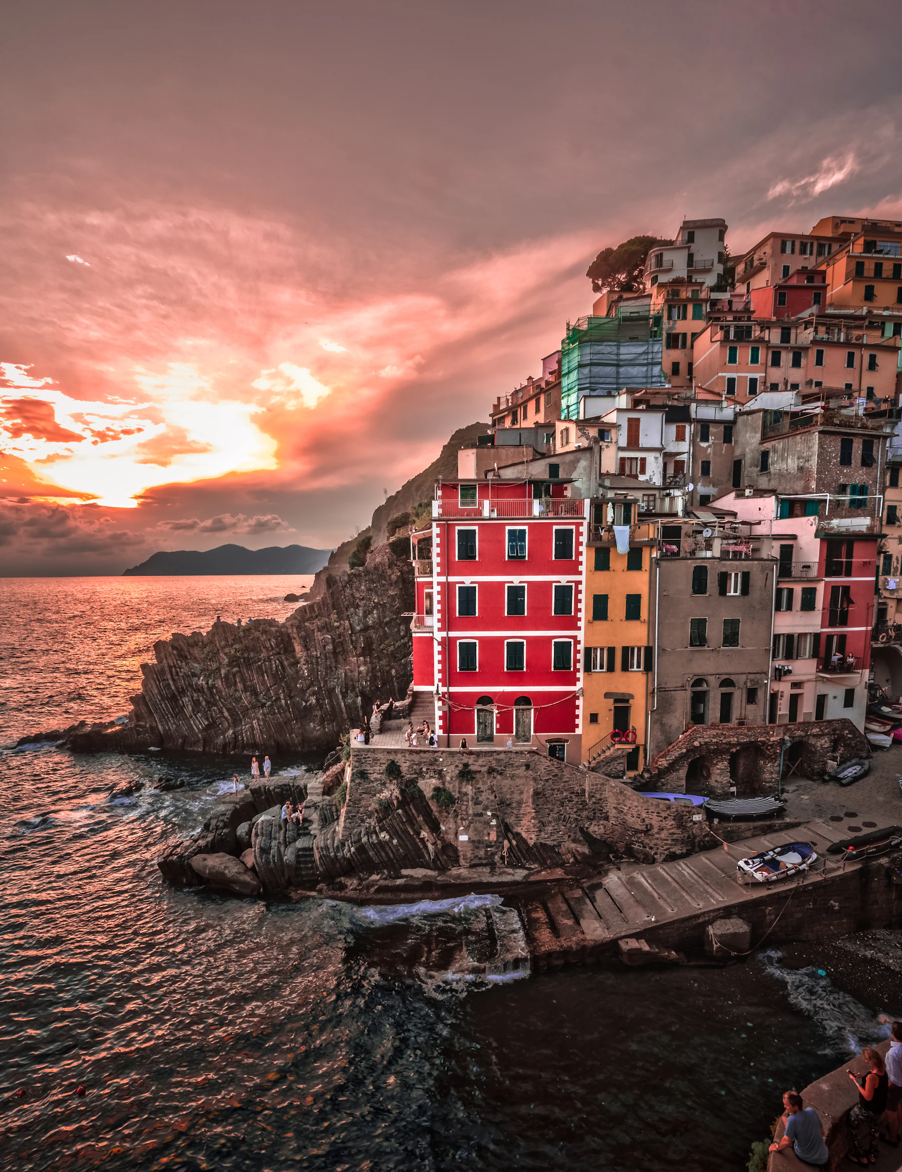 Colourful houses of Cinque Terre above the sea at sunset