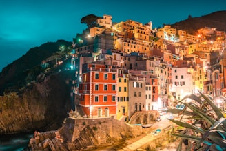 A vibrant village illuminated at dusk by solar-powered microgrid lights, showcasing sustainable energy in action.