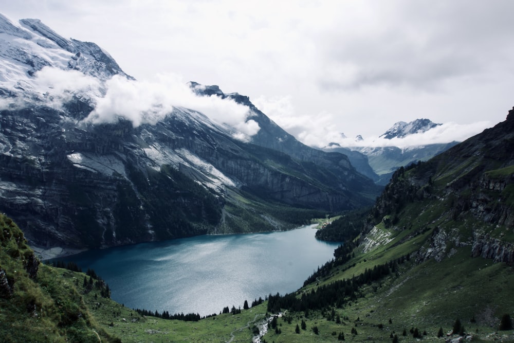 wide-angle photography of lake and mountain range during daytime