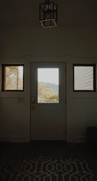 Finished interior view showing clean, modern UPVC door and window frames with natural light.