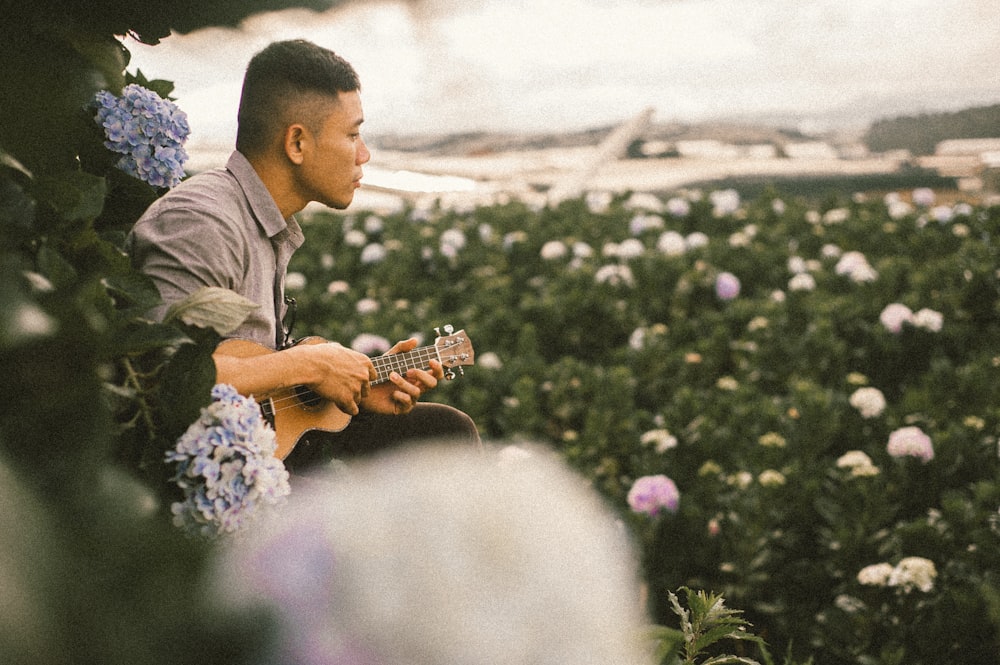 man using ukulele