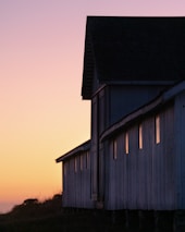 Historic buildings of the Hawkins Ranch at sunset.
