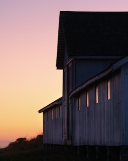 Historic buildings of the Hawkins Ranch at sunset.