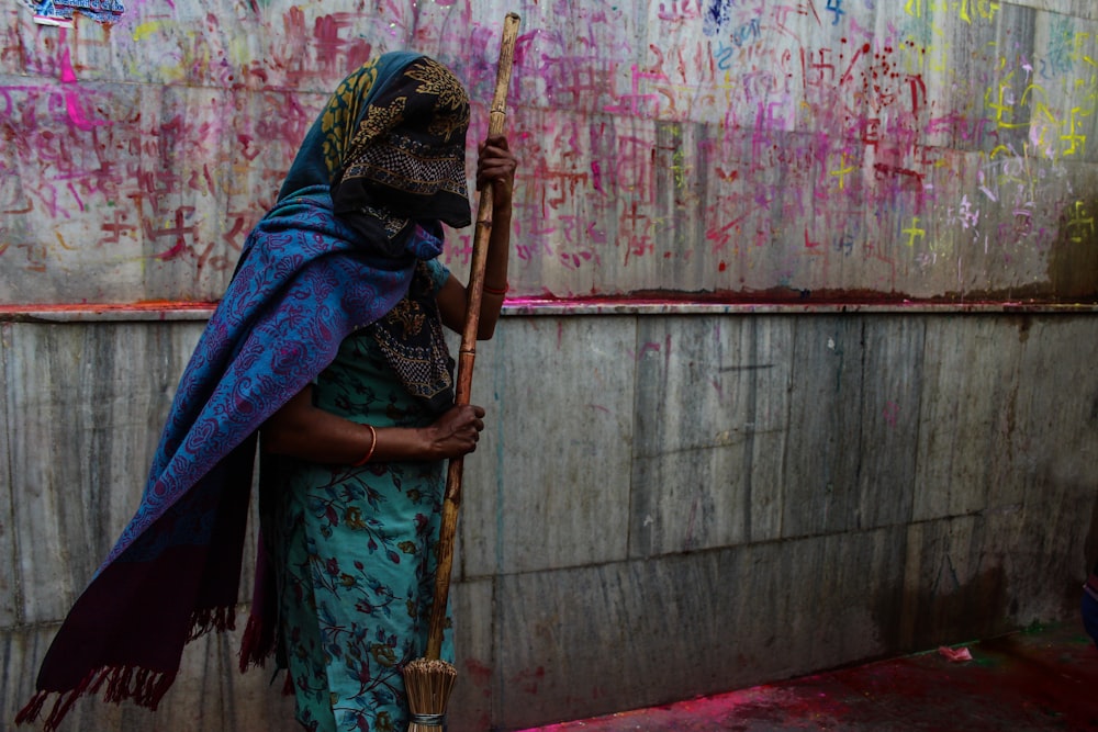 woman stands and wipes ground