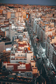 An urban cityscape painting showcasing bustling streets and modern architecture.