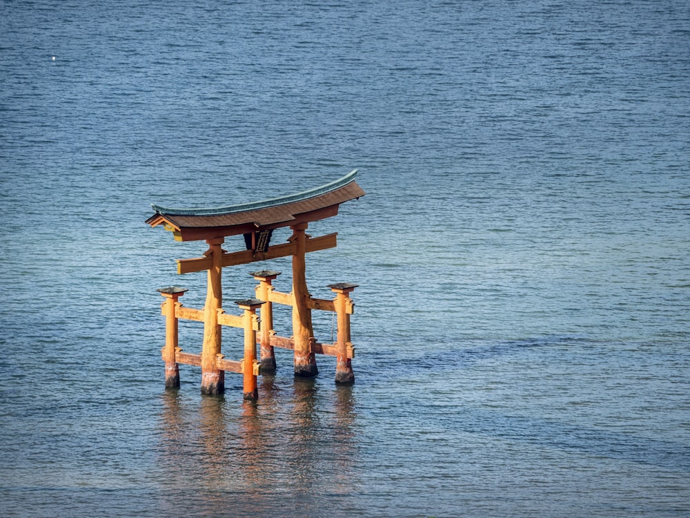 brown gate in body of water