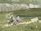 Cyclists navigating a challenging trail, symbolizing teamwork and determination.