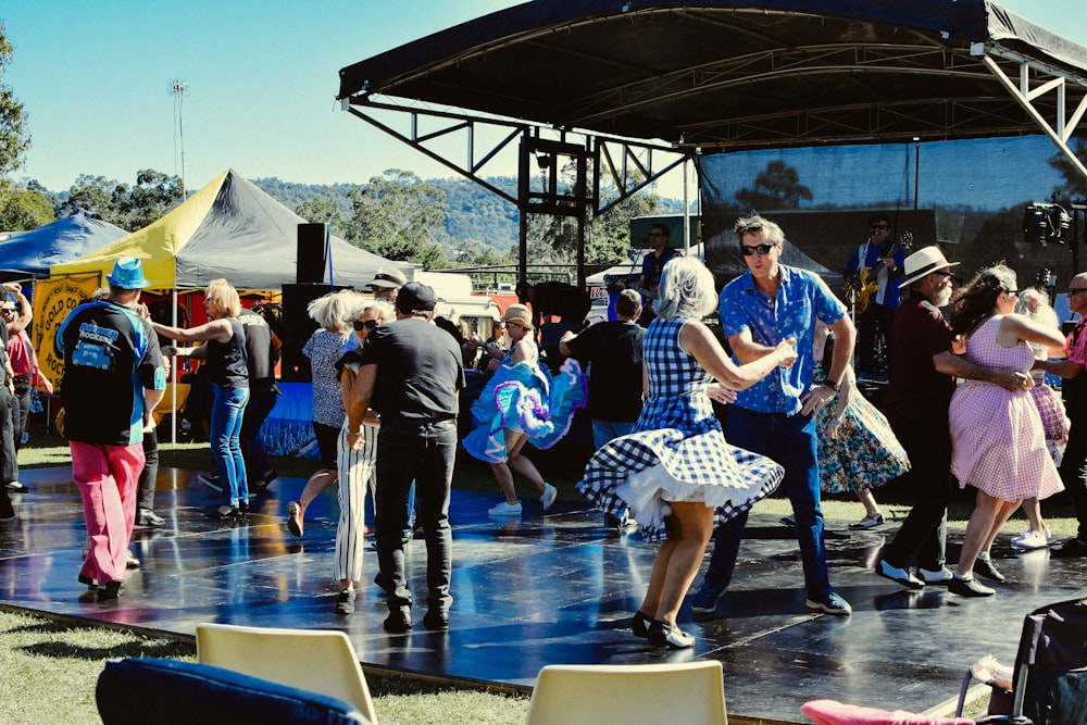 men and women dancing on a dancefloor