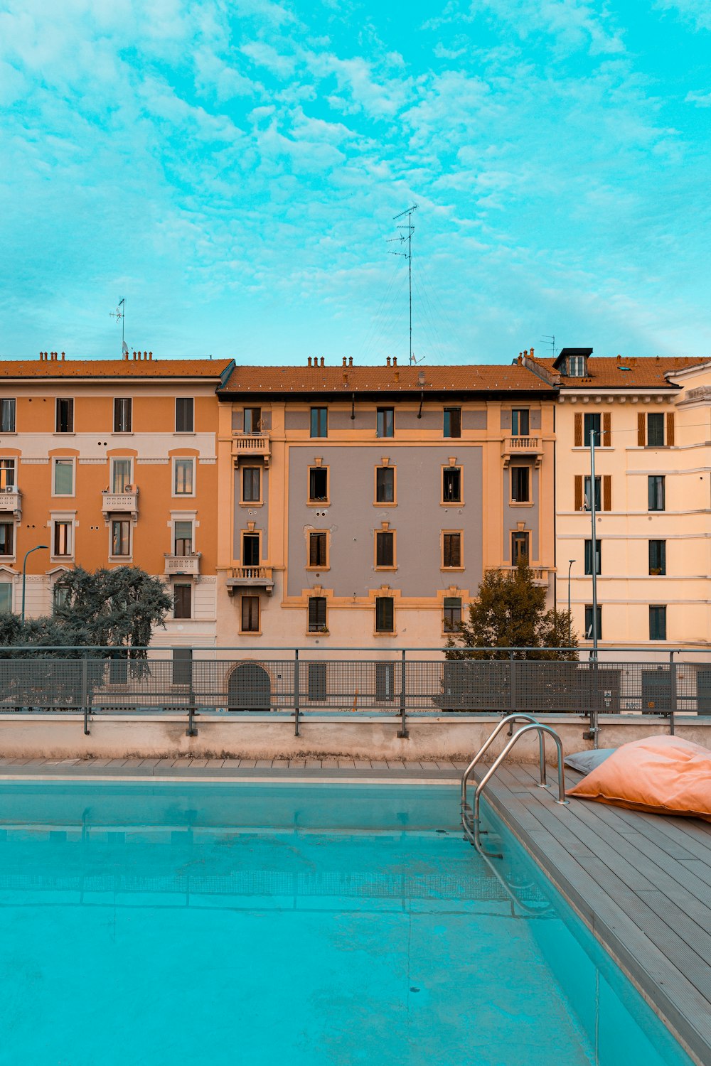 swimming pool near building at daytime