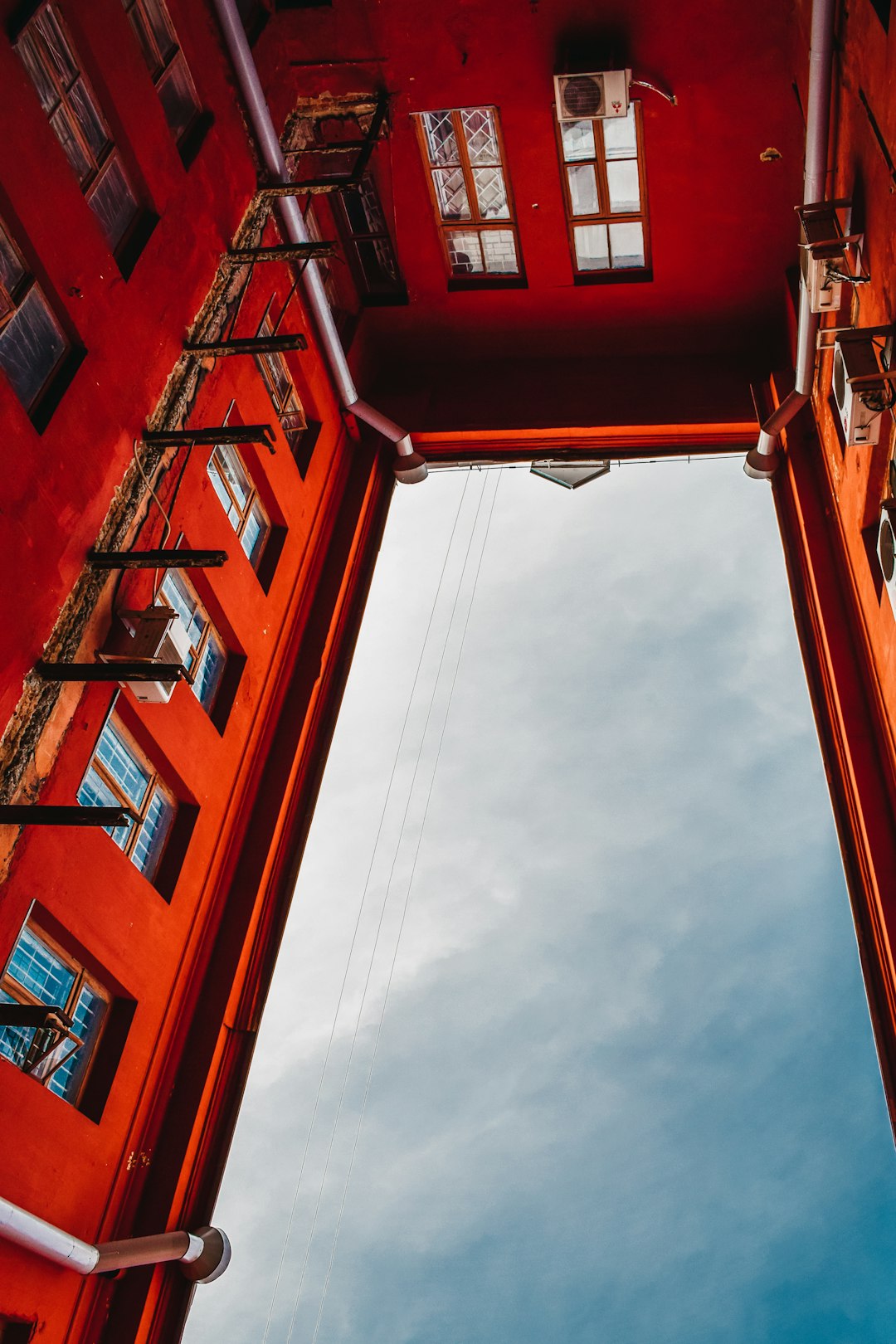 orange painted building in low-angle photo