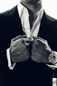 grayscale photography of man's suit
