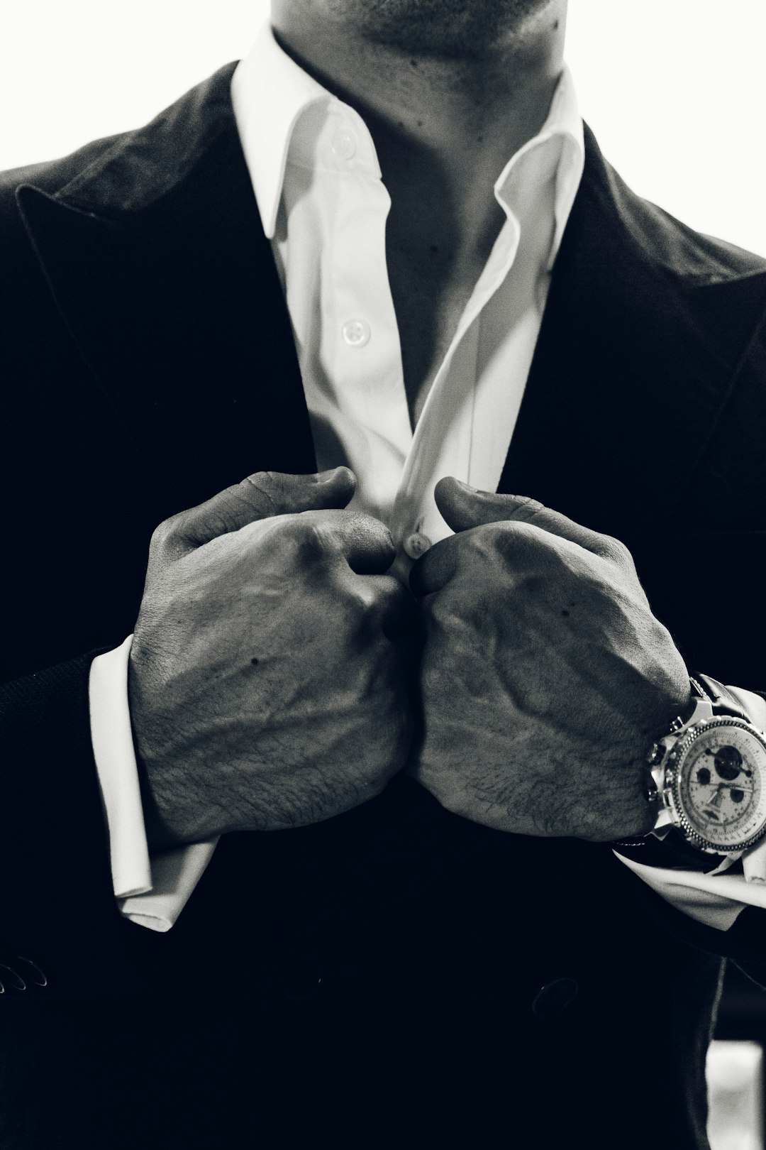 grayscale photography of man's suit