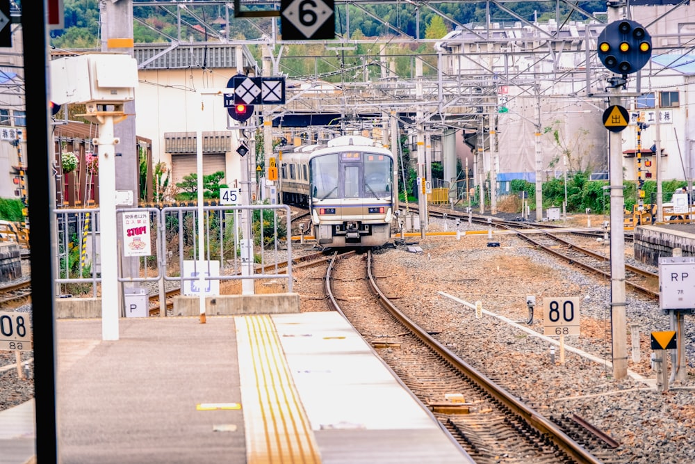 train on railway during daytime