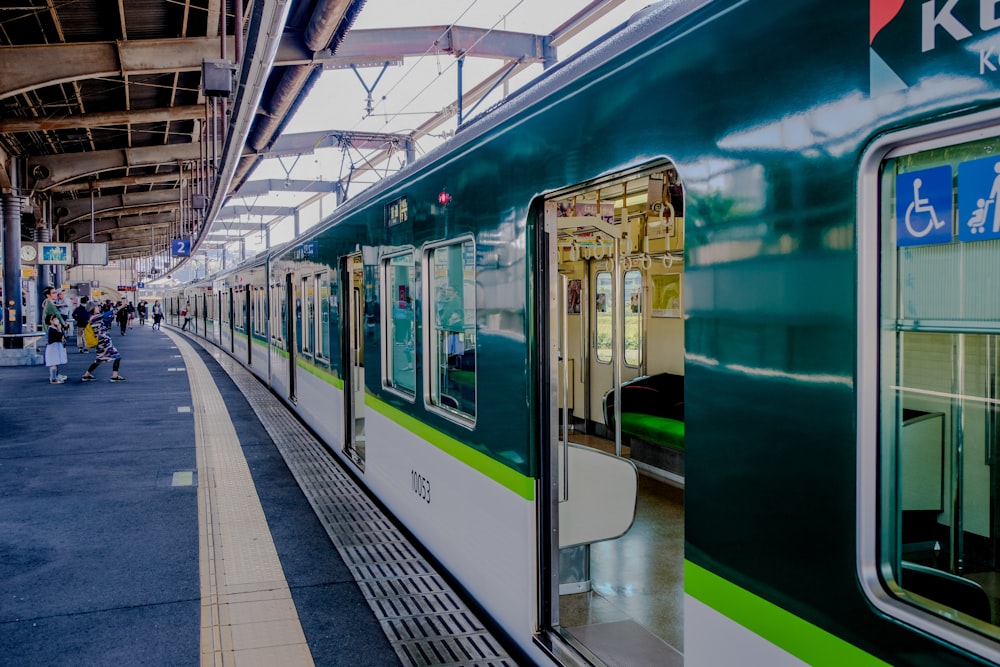 opened white and green train door