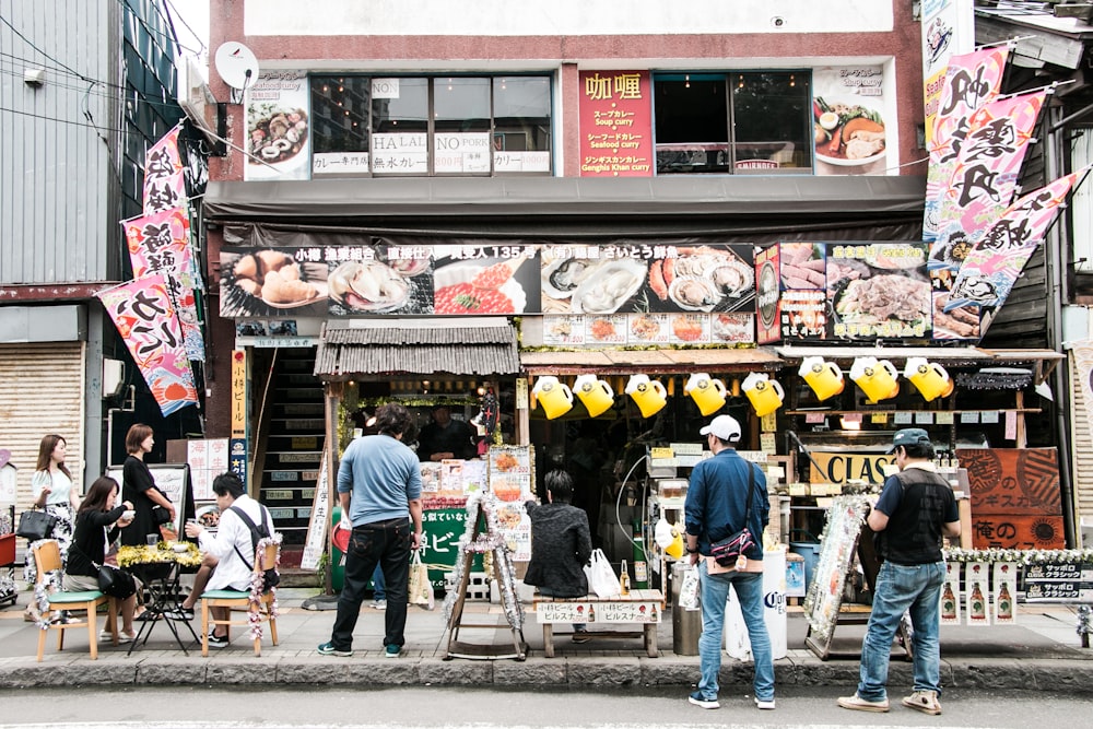 people standing beside store