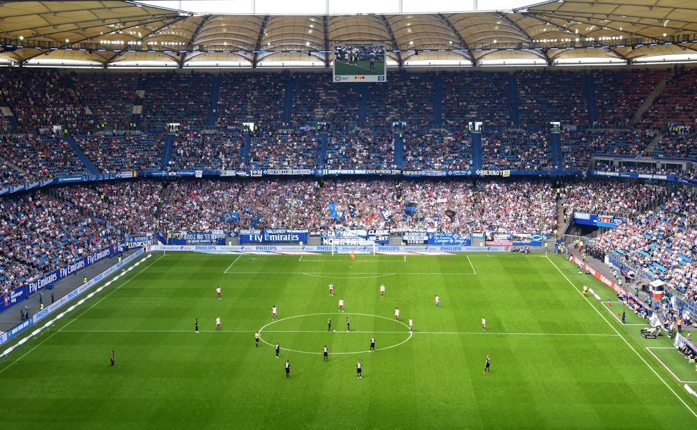 people inside soccer stadium during day