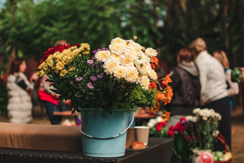 white flowers in bucket