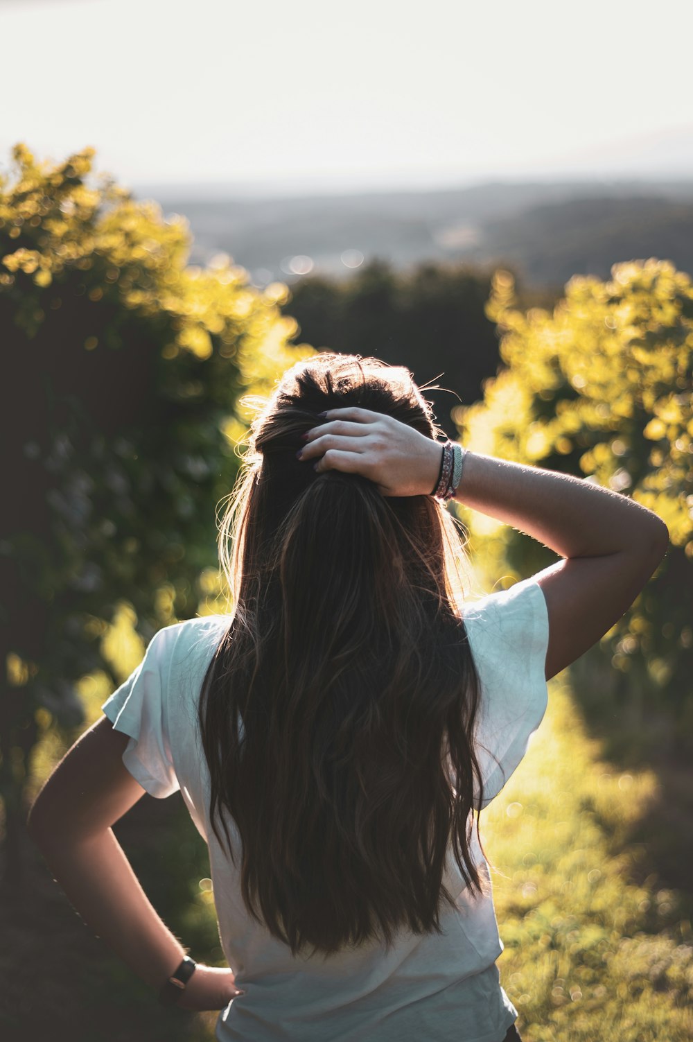 woman holding her hair