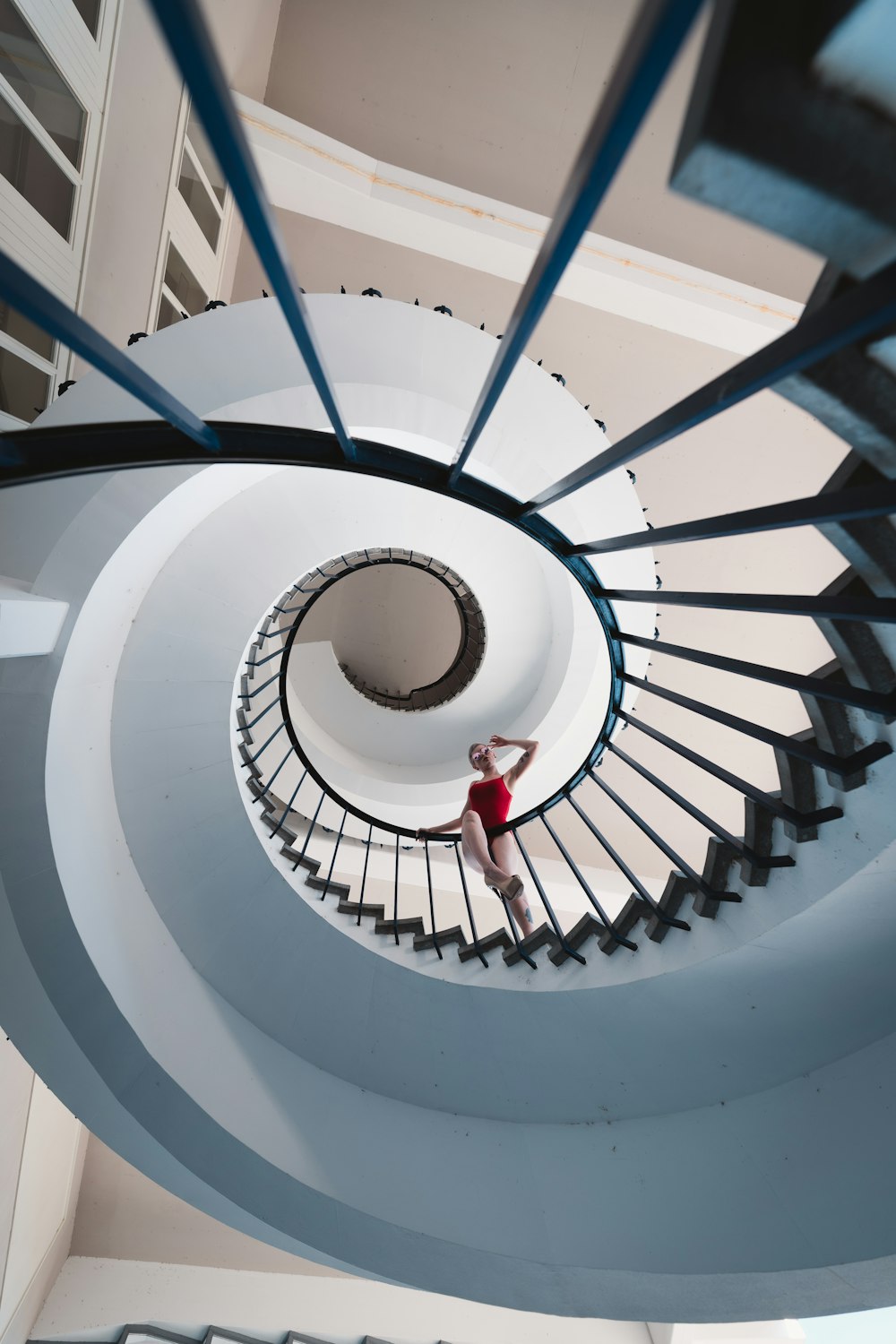 woman standing on stairs in low-angle photo