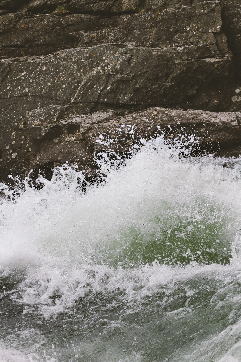 water splashing on rock