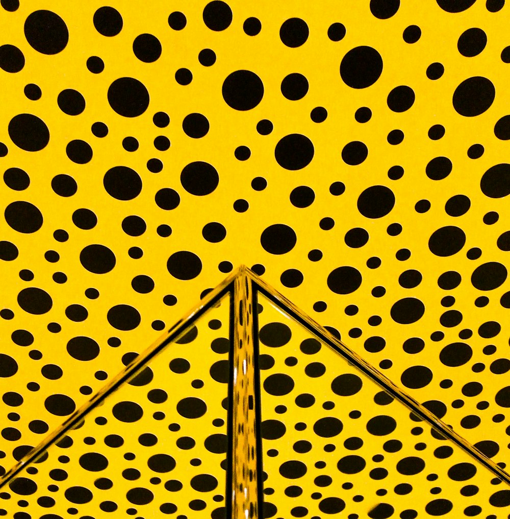 yellow and black polka-dot wall