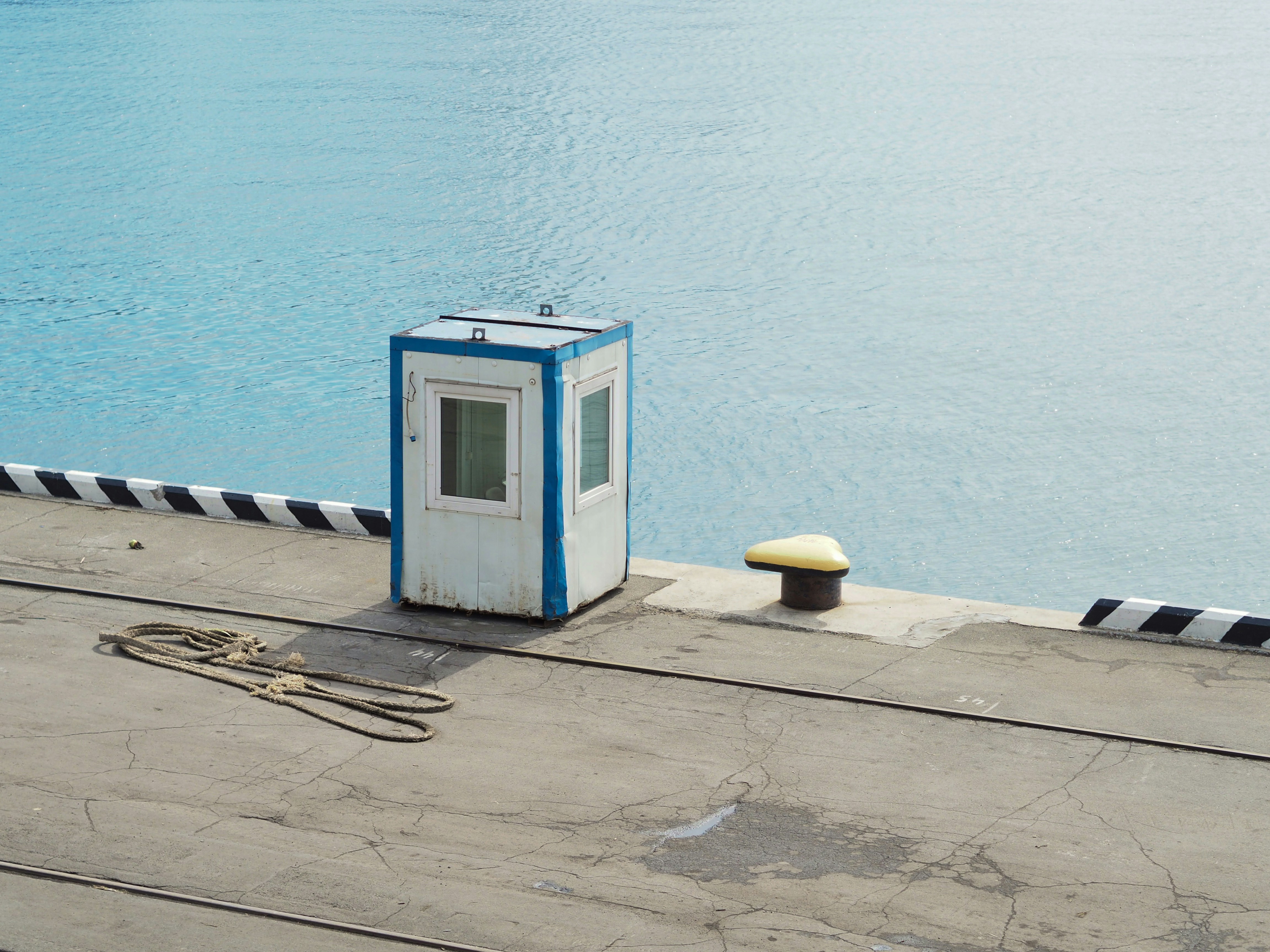 white shed near water