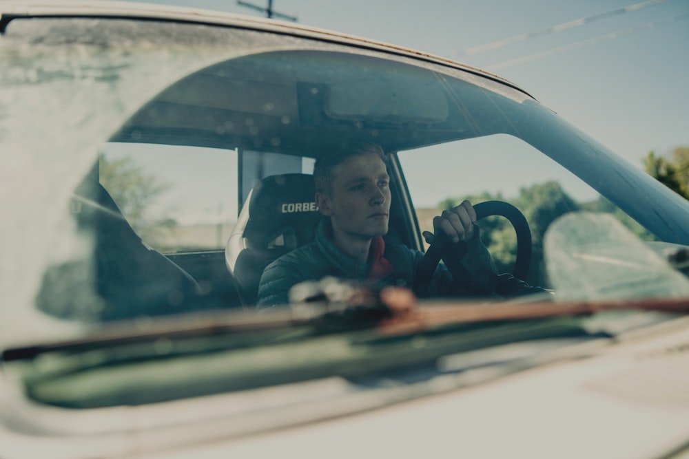 man sitting on driver seat