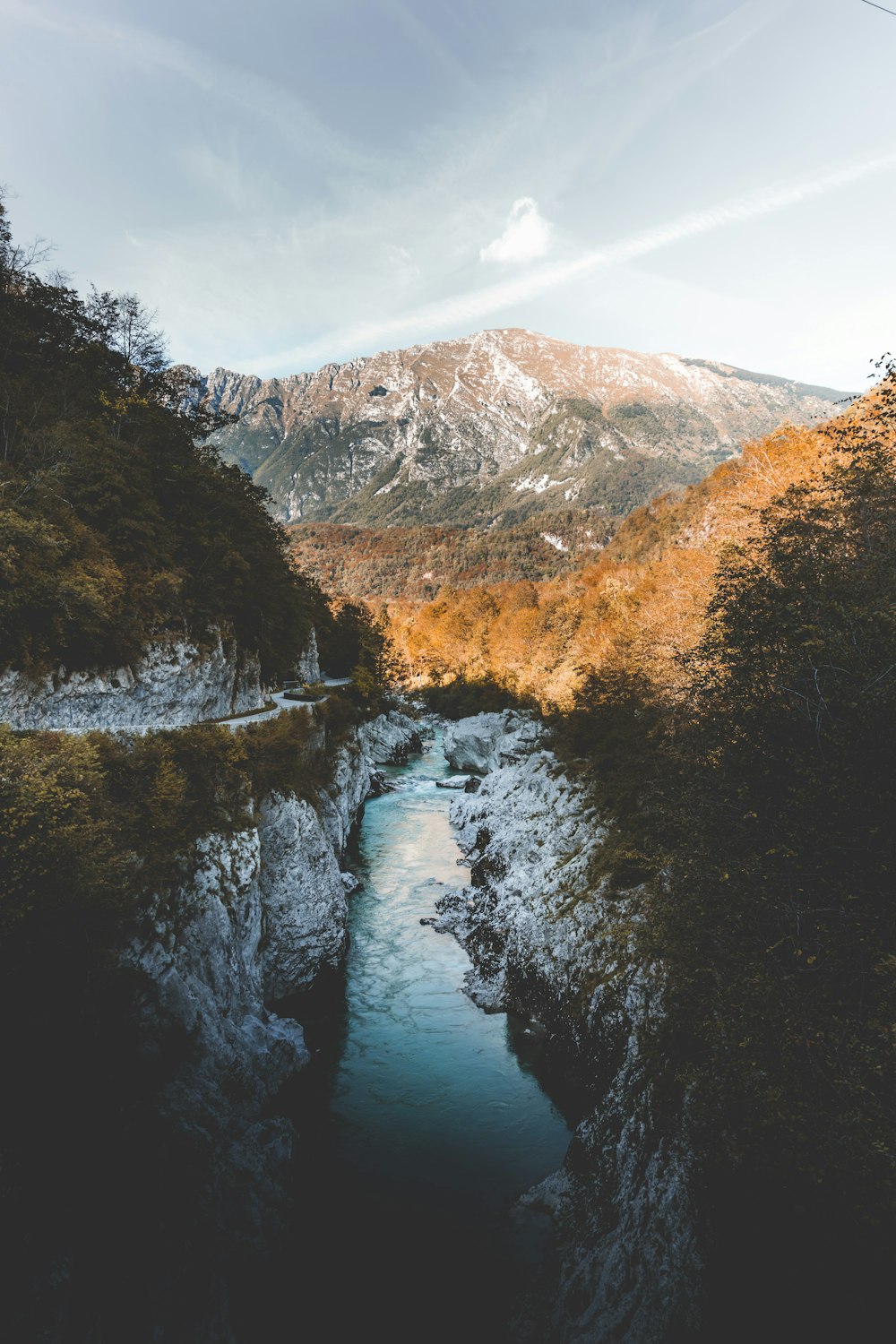 body of water between rock cliffs