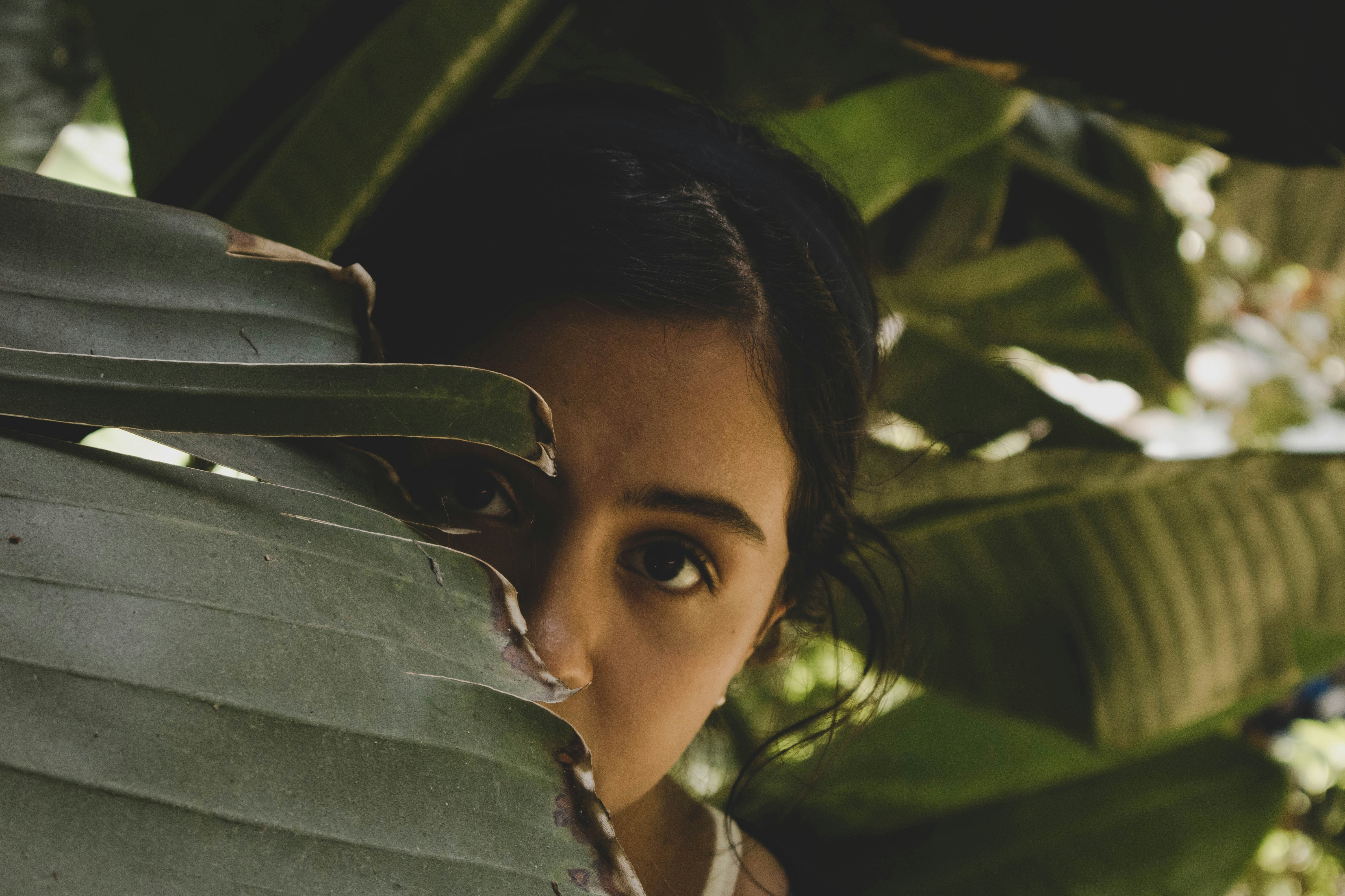 Girl hiding in the garden